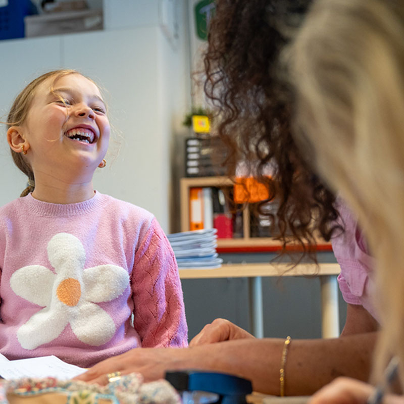 girl laughing in class